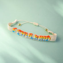 Laden Sie das Bild in den Galerie-Viewer, Gewebtes Armband Schulkind natur/regenbogen